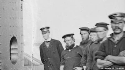Welsh-born fireman Robert Williams (far right) is pictured with the ship's crew
