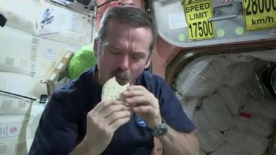 Chris Hadfield eating his space sandwich