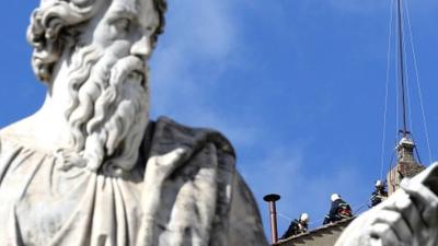 Firefighters on top of the Sistine Chapel