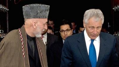 President Hamid Karzai (l) and US Defence Secretary Chuck Hagel (r).