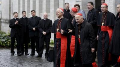 Cardinals go to enter the Sistine Chapel