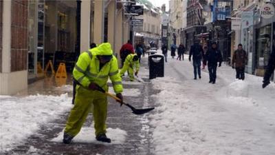 Workers clearing snow in King Street