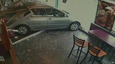 CCTV image of car crashing into Dunkin' Donut branch, Philadelphia