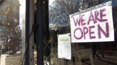 'We are open' shop sign