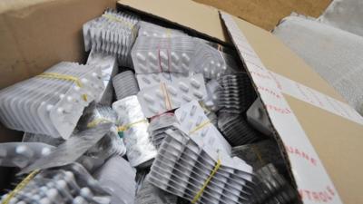 A box of seized counterfeit medical pills found at customs