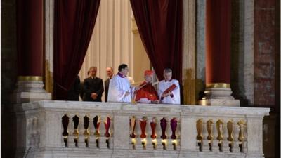 French proto-deacon cardinal Jean-Louis Tauran (C) announces the name of the new Pope