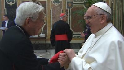 Pope Francis greets the cardinals