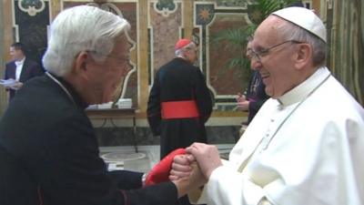 Pope Francis greets the cardinals