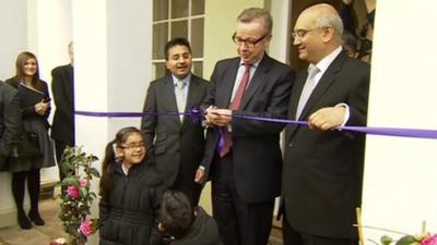 Michael Gove cuts the ribbon