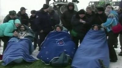 Soyuz crew in blankets