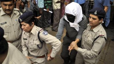 Swiss woman escorted by police to hospital