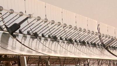 Parabolic mirrors collect sunlight at concentrated solar power plant