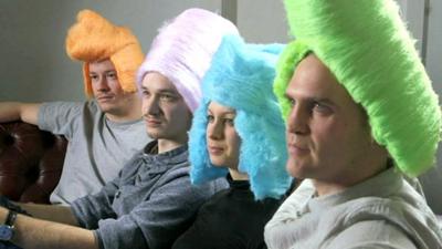 Inventors testing some brightly coloured wigs