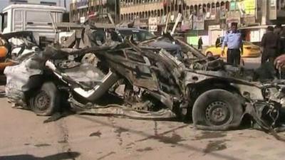 Burned-out car in Baghdad