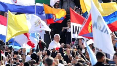 Pope surrounded by crowds