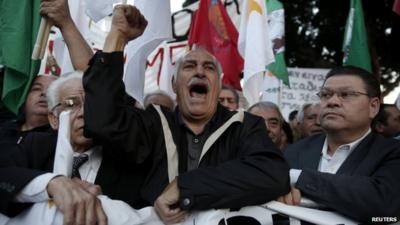 Protesters rally outside parliament