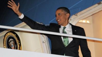 President Barack Obama boards Air Force One