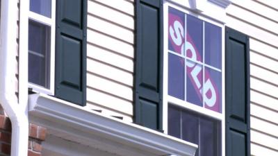 House with SOLD sign in the window