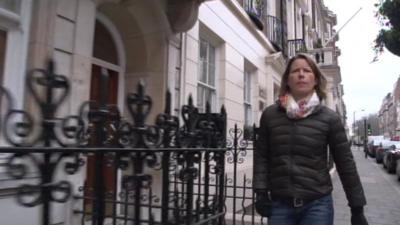 Stephanie Flanders walks down a London street