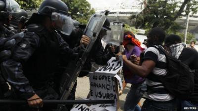 Supporters of a native Indian community living at the Brazilian Indian Museum clash with military police officers