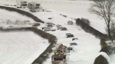 Vehicles buried in snow drifts in Cumbria