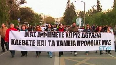 Bank workers and members of the public protesting in Cyprus