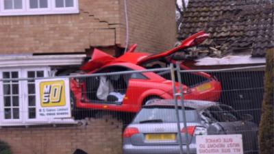 Audi embedded in Lowestoft house wall