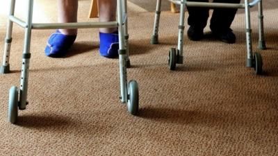 Elderly people on zimmer frames