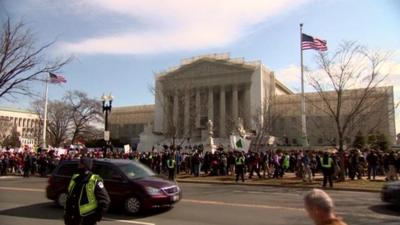 Supporters and opponents demonstrating outside the Supreme Court