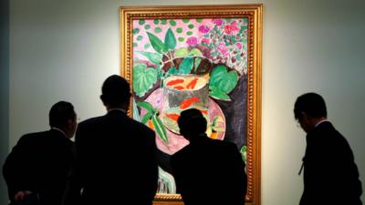 Japanese visitors look at the Gold Fish, a 1912 masterpiece by French painter Henri Matisse, during a preview of the exhibition 'Masterworks of French Impressionism and Modernism