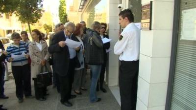 Customers at a Cypriot bank