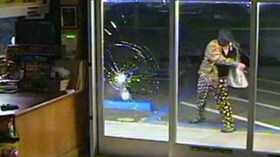 Man tries to smash a window