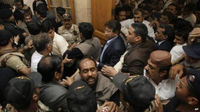 An angry lawyer threw a shoe at former President Musharraf as he entered into court