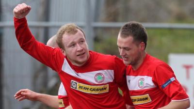 Liam Boyce celebrates his goal with Ciaran Caldwell