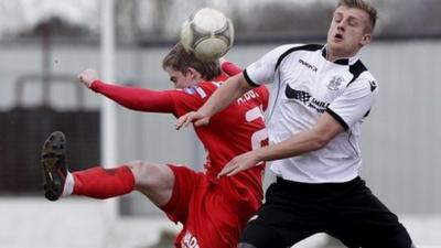 Match action from Lisburn Distillery against Portadown at Ballyskeagh