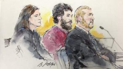 Colorado shooting suspect James Holmes and his public defenders Tamara Brady and Daniel King are pictured in a courtroom sketch during a hearing in Centennial