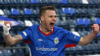 Linfield's Peter Thompson celebrates his goal against Glentoran