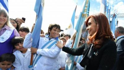 Argentine President Cristina Fernandez de Kirchner (R) greeting pupils and teachers during the commemoration ceremony of the 31st anniversary of the 1982 Falklands War with Britain