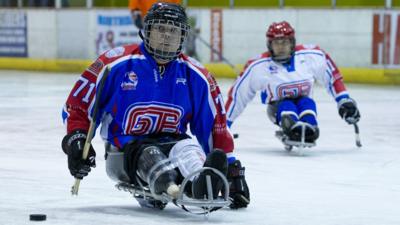 GB Paralympic sledge hockey players prepare to hit puck