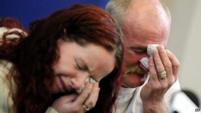 Mick and Mairead Philpott react during a news conference following a fire at their home