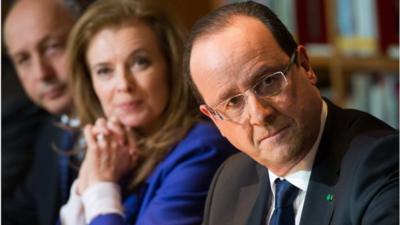 French President Francois Hollande (R) attends a meeting with local civil society members at the Kingdom of Morocco"s National Library in Rabat