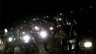 Motorbikes heading to the airstrip