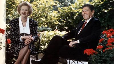 US President Ronald Reagan and former British Prime Minister Margaret Thatcher posing for photographers on the patio outside the Oval Office