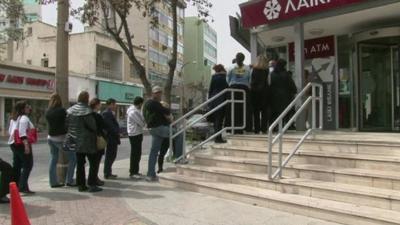 People queuing for a cash point in Cyprus