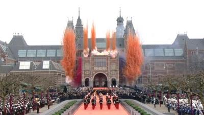 Orange, re, white and blue smoke from fireworks outside the Rijksmuseum