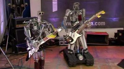 Compressorhead's guitarist, Fingers, and bassist, Bones