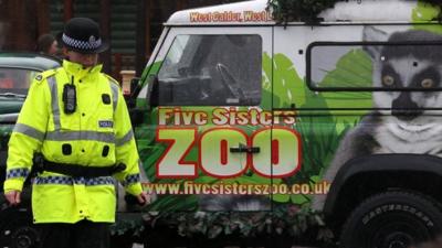 Police officer by Five Sisters Zoo vehicle