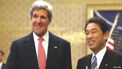 US Secretary of State Kerry shakes hands with Japans Foreign Minister Kishida in Tokyo