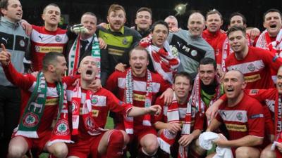 Cliftonville celebrate winning the Irish Premiership