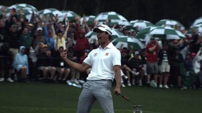 Adam Scott celebrates a putt on the 18th